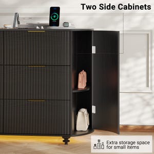 May include: Black two-door side cabinet with three drawers and gold-colored handles. The cabinet has a textured, vertical-lined design. The open door reveals a shelf with a pink purse and a white purse. The text reads "Two Side Cabinets" and "Extra storage space for small items."