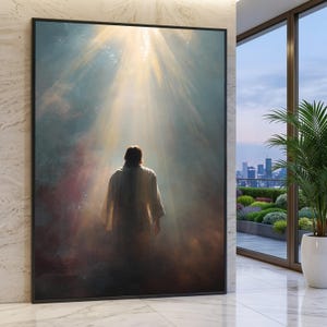 May include: A framed art print depicts a figure in a white robe, illuminated by a bright light from above. The artwork features a blend of blues, browns, and yellows, creating a spiritual and ethereal atmosphere. The image is set against a dark background.