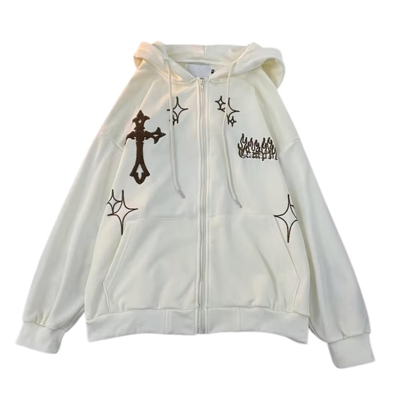 May include: Cream-colored zip-up hoodie with a hood and front pockets. The hoodie features brown embroidered designs, including a cross, stars, and text. The jacket has a full-length zipper and long sleeves.