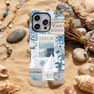 May include: A blue and white phone case with a coastal theme. The case features images of seashells, a sailboat, and the text "Coastal Life" and "East Coast". The case is surrounded by sand, seashells, and jewelry.
