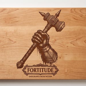 May include: A rectangular wooden cutting board featuring a laser-engraved illustration of a gauntleted hand gripping a war hammer. Below the illustration is a decorative banner containing the text FORTITUDE and ENDURANCE FROM WITHIN.