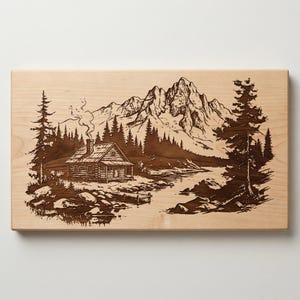May include: A wooden cutting board with a detailed engraving of a cabin nestled in a forest at the foot of a mountain range. The cabin has smoke rising from its chimney. The artwork is in shades of brown.