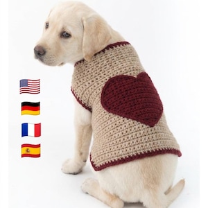 Puede incluir: Un suéter de perro de ganchillo beige y burdeos con un diseño de corazón. El suéter para perros está hecho de un hilo suave y texturizado y presenta un gran corazón burdeos en la espalda. El suéter tiene un ribete acanalado y es cómodo.