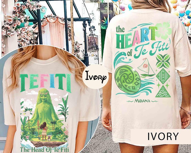 May include: Ivory-colored t-shirt featuring the text "TEFITI" in green and pink letters. The front graphic depicts a green figure and the text "The Head Of Te Fiti". The back of the shirt displays "the HEART of Te Fiti" and "MOANA".