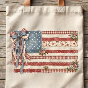 May include: Cream-colored tote bag featuring a decorative American flag design. The flag incorporates red and white stripes with floral and gingham patterns, a blue polka-dot field, and a bow with flowing ribbons. Floral accents are placed around the flag.
