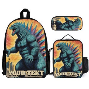 May include: A backpack, a lunch bag, and a pencil case set featuring a graphic of a teal, muscular monster with sharp dorsal fins against an orange and yellow background. Each item displays the text YOUR TEXT in bold, light-colored capital letters.