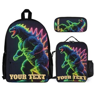 May include: A black backpack, lunch bag, and pencil case set featuring a neon-style graphic of a large reptilian monster with glowing green and pink outlines. Each item displays the text YOUR TEXT in a bold, light-colored serif font at the bottom.