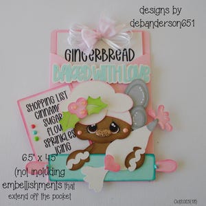 May include: A whimsical gingerbread-themed papercraft design. It features a gingerbread person with a chef's hat, a shopping list, and the text "GINGERBREAD BAKED WITH LOVE." The pocket measures 6.5" x 4.5".
