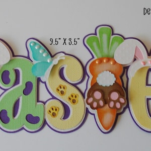 May include: A colorful Easter-themed decoration spelling out "EASTER". The letters are adorned with bunny ears, butterflies, and a carrot. The decoration measures 9.5" x 3.5".
