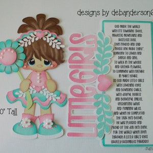 May include: A paper craft of a little girl holding a flower. The girl is wearing a pink dress with a green skirt and white shoes. The background is a pink and green paper with the words "Little Girls" and a poem about little girls. The craft is 7 inches tall.