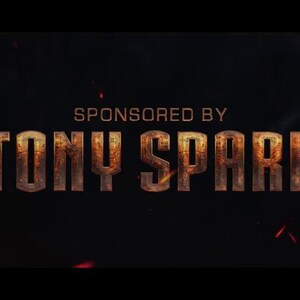 May include: Dark background with the text "SPONSORED BY TONY SPARK" in a distressed, metallic font. The Adobe Premiere Pro logo is in the upper right corner. Red sparks are scattered across the image.