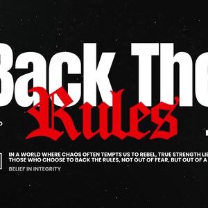 May include: Black graphic design with the words "Back The Rules" in white, with "Rules" in red gothic font. The text "I STAND TO BACK THE RULES" is below the main text. Additional text at the bottom.