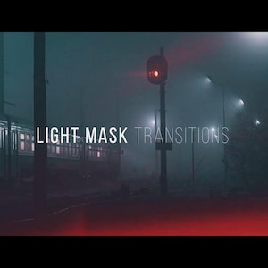 May include: A cinematic image of a train at a station at night, shrouded in fog. The words "LIGHT MASK TRANSITIONS" are displayed in white text. A red signal light is illuminated, and streetlights cast a dim glow.