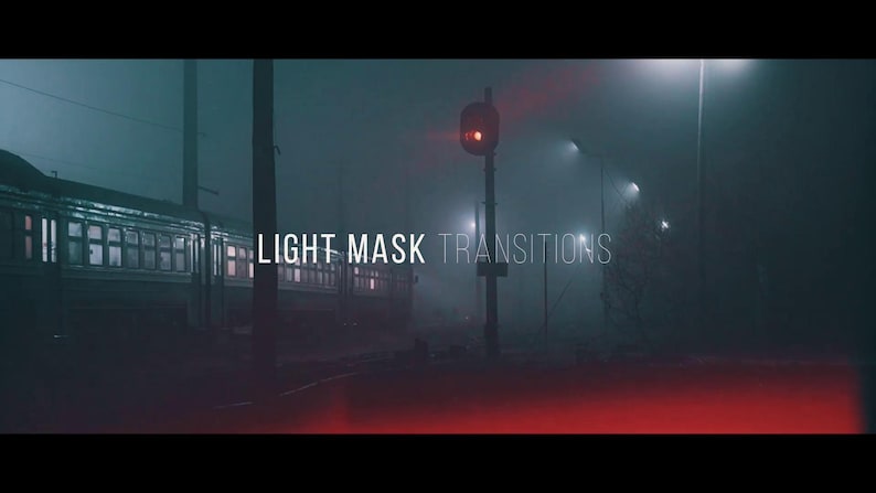 May include: A cinematic image of a train at a station at night, shrouded in fog. The words "LIGHT MASK TRANSITIONS" are displayed in white text. A red signal light is illuminated, and streetlights cast a dim glow.