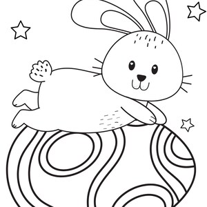 May include: A black and white line drawing of a bunny rabbit sitting on a large, decorated Easter egg. The bunny has a cute, cartoon-like face and is surrounded by small stars.