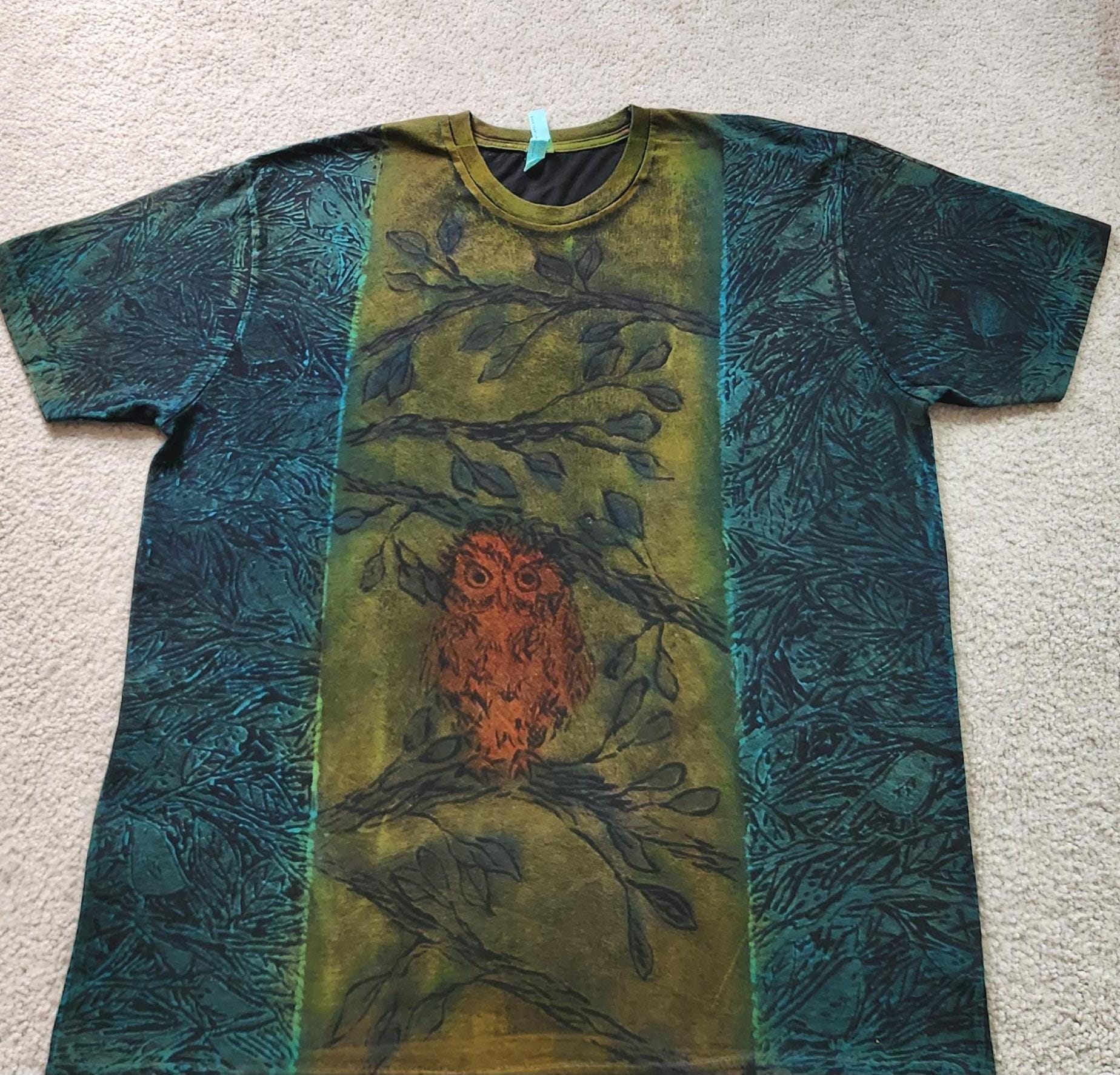 Baby owl perched on leafy branches, small birds, leaves on blue background, printed, discharged, dye