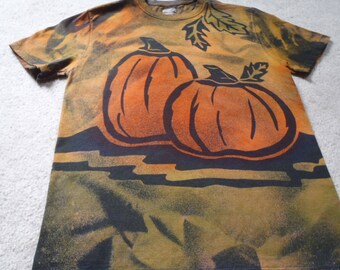 Fall pumpkins, a black cat, stars and leaves, man's small discharged and dyed Jerzees t-shirt with freezer paper cutouts, orange and green