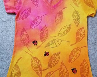 Falling leaves with line designs, pink, orange and yellow, colors blended, red ladybugs, woman's medium v-neck shirt printed & dyed