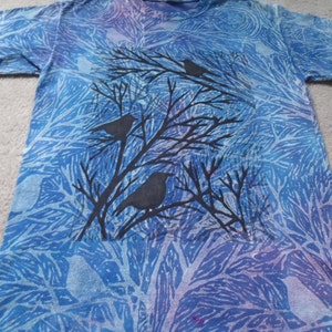 Birds in treetops, man's medium t-shirt, low immersion dyeing in blues, discharged with block printing and therm fax screens, reduced price