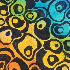 May include: Abstract artwork featuring a pattern of black, organic shapes with colorful gradients. The colors transition from orange to yellow, green, blue, and purple, creating a vibrant and eye-catching design.