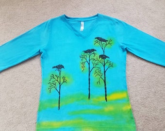 Black birds gather on the tree tops, woman's medium t-shirt, v-neck and 3/4 sleeves, printed and dyed, blues & yellow, a favorite screen