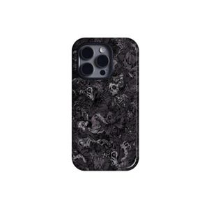 May include: Black phone case featuring a detailed, dark pattern of skulls and skeletal figures. The case has a glossy finish and a rounded shape, with cutouts for the camera lenses. The design is intricate and creates a gothic aesthetic.