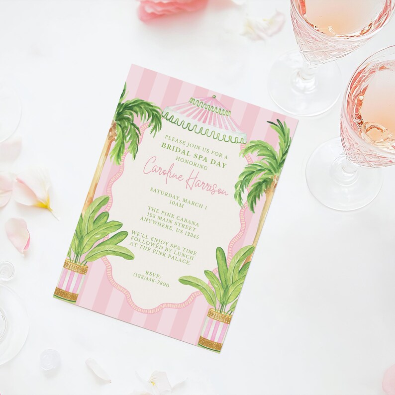 May include: A pink and white striped invitation for a bridal spa day. The invitation features palm trees, a decorative border, and the text "Caroline Harrison" in cursive. The invitation also includes the date, time, and location of the event.