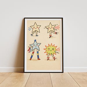 May include: A framed art print featuring four cartoon stars with smiling faces and limbs. The stars are in various colors, including yellow, blue, and green, and are depicted dancing. The artwork is set against a beige background.