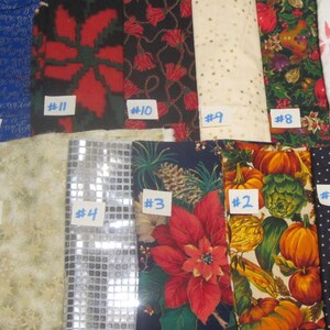 May include: Thirteen folded fabric swatches arranged in two rows, each labeled with a white paper tag numbered 1 through 13. The collection features various patterns including floral, pumpkin, poinsettia, polka dot, and metallic geometric designs.