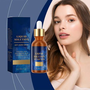 May include: A woman with a bottle of Liquid Solution Anti-Aging Serum. The serum bottle is amber with a gold dropper and a blue label. The box and bottle both display the text "Liquid Solution" and "Anti-Aging Serum". The text "Fade Fine Lines and Uncover Your Youthful Glow" is also visible.