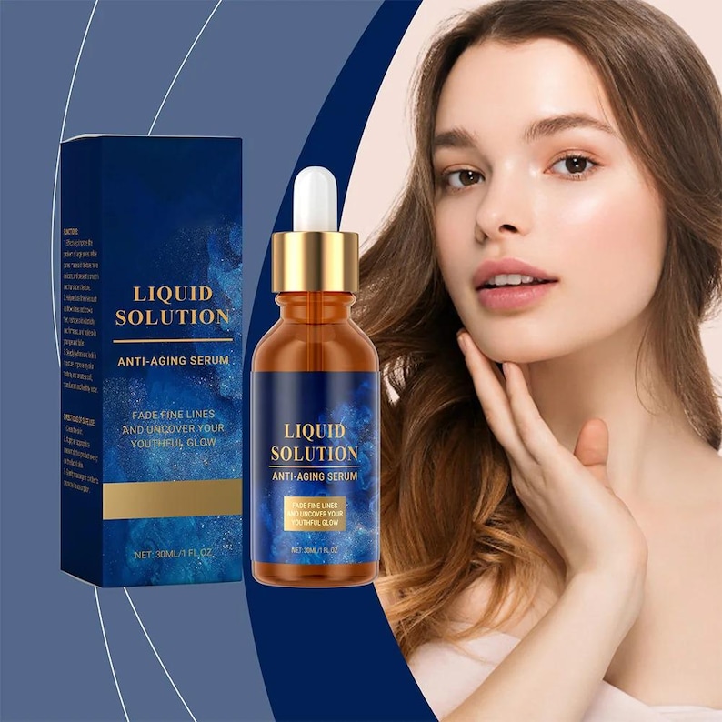 May include: A woman with a bottle of Liquid Solution Anti-Aging Serum. The serum bottle is amber with a gold dropper and a blue label. The box and bottle both display the text "Liquid Solution" and "Anti-Aging Serum". The text "Fade Fine Lines and Uncover Your Youthful Glow" is also visible.