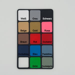 May include: A black color palette with 16 color swatches. The colors include white, gray, black, beige, gold, pink, brown, red, dark red, dark blue, blue, light blue, white, green, and dark green. Each color is labeled with its name.