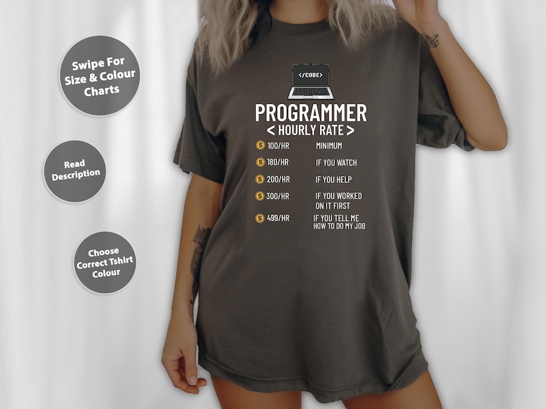 May include: Dark grey t-shirt featuring the word "PROGRAMMER" and a laptop graphic. It lists hourly rates and conditions such as "If you watch" or "If you help." The shirt also has text that says "Swipe For Size & Colour Charts", "Read Description", and "Choose Correct Tshirt Colour".
