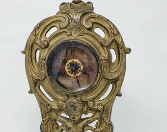 Antique Cherub clock Pat. 1906 scrollwork clock Cast Iron gold color overlay mantle clock decorative