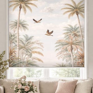 May include: A window roller shade featuring a tropical landscape scene. The design includes palm trees, birds in flight, and a soft, cloudy sky. The color palette is muted with beige, green, and brown tones, creating a serene atmosphere.