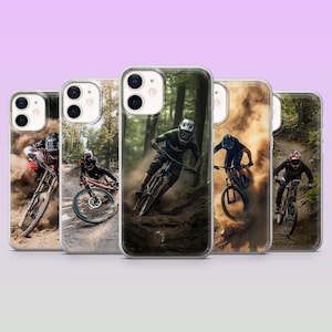 May include: Five phone cases displaying mountain bikers in action. Each case shows a different rider on a dirt track, with dust and forest scenes. The cases have a clear border and a glossy finish, offering protection and style.