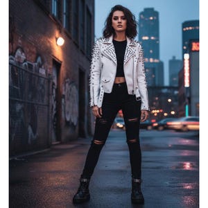 May include: A white leather jacket with silver spikes on the shoulders and sleeves. The jacket is worn with a black crop top and black ripped jeans. The outfit is completed with black combat boots. The background is an urban street scene.