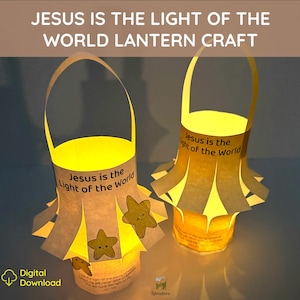May include: Two yellow paper lanterns with handles, each featuring the text 'Jesus is the Light of the World' and small star cutouts with smiling faces. The lanterns are illuminated from within, casting a warm glow against a dark background.
