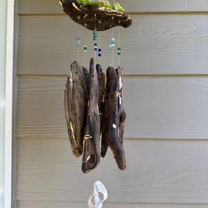 May include: A distressed wooden sign, reading "Welcome to our home" in white. The sign has a rustic finish, ideal for a front door or hallway, creating a welcoming atmosphere.