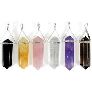 May include: Six crystal point pendants with silver settings. The crystals are black, yellow, pink, clear, purple, and brown.