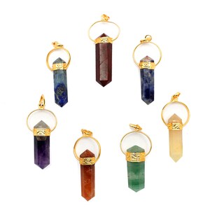 May include: Seven gold-toned pendants with different colored gemstone points. The pendants are in a circle on a white background. The gemstones are amethyst, red jasper, lapis lazuli, sodalite, clear quartz, green aventurine, and carnelian.