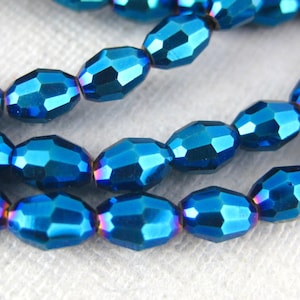 Chinese Crystal Beads - Mystic Blue Chinese Crystal Faceted Rice Beads - 1 STRAND (S103B10-01G)