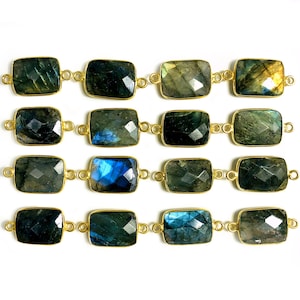 May include: A strand of 12 gold-toned labradorite gemstone beads, each with a rectangular faceted shape. The beads are connected by gold-toned links.