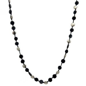 May include: A long necklace with alternating black and silver round beads.