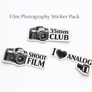 May include: A set of film photography stickers. The stickers have black and white illustrations of cameras and text that reads "35mm CLUB", "SHOOT FILM", and "I LOVE ANALOG".