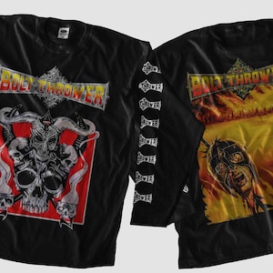 May include: Black long-sleeved shirt with the band name "Bolt Thrower" in a metallic design. The front features a skull graphic with horns and a red background. The back shows a warrior graphic with a yellow and orange background. Sleeves have tour dates.