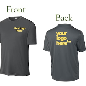 May include: A dark gray short-sleeve t-shirt shown from the front and back. The front features the yellow text "Your Logo Here" on the left chest. The back displays the larger yellow text "your logo here&trade;" centered across the upper back area.