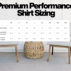 May include: A sizing chart titled Premium Performance Shirt Sizing, displaying measurements in inches for sizes XS through 4XL. The table lists body length, chest width laid flat, and sleeve length for each size, presented in a clear grid format.
