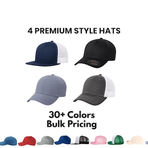 May include: Four baseball caps displayed in a grid, including a navy and white trucker hat, a solid black cap, a solid grey cap, and a charcoal and white trucker hat. Text reads 4 PREMIUM STYLE HATS and 30+ Colors Bulk Pricing above a row of swatches.