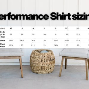 May include: A sizing chart titled Performance Shirt sizing displays measurements in inches for sizes XS through 4XL. The table lists body length at back, sleeve length, and chest width for each size, presented against a white background.